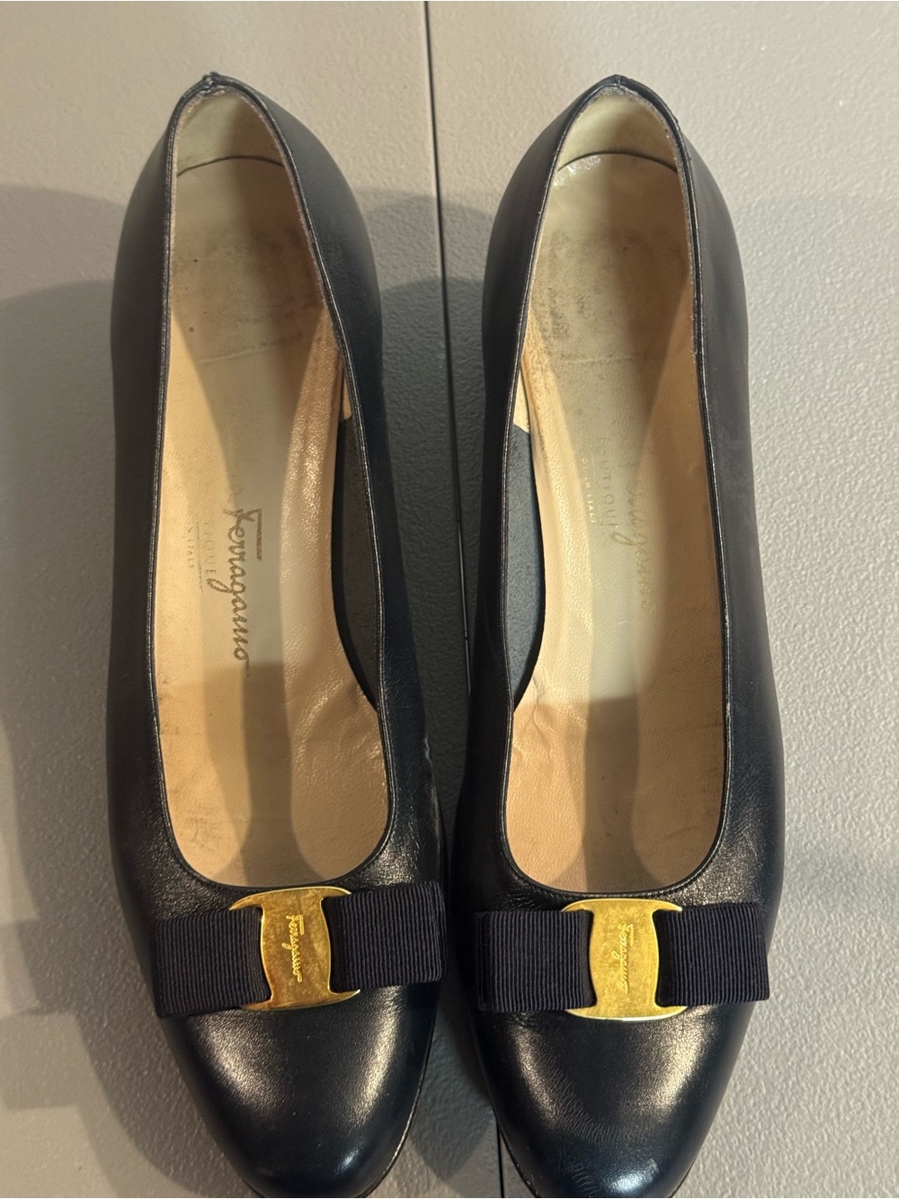 Salvatore Ferragamo Black Leather Pumps with Gold Bow Accent